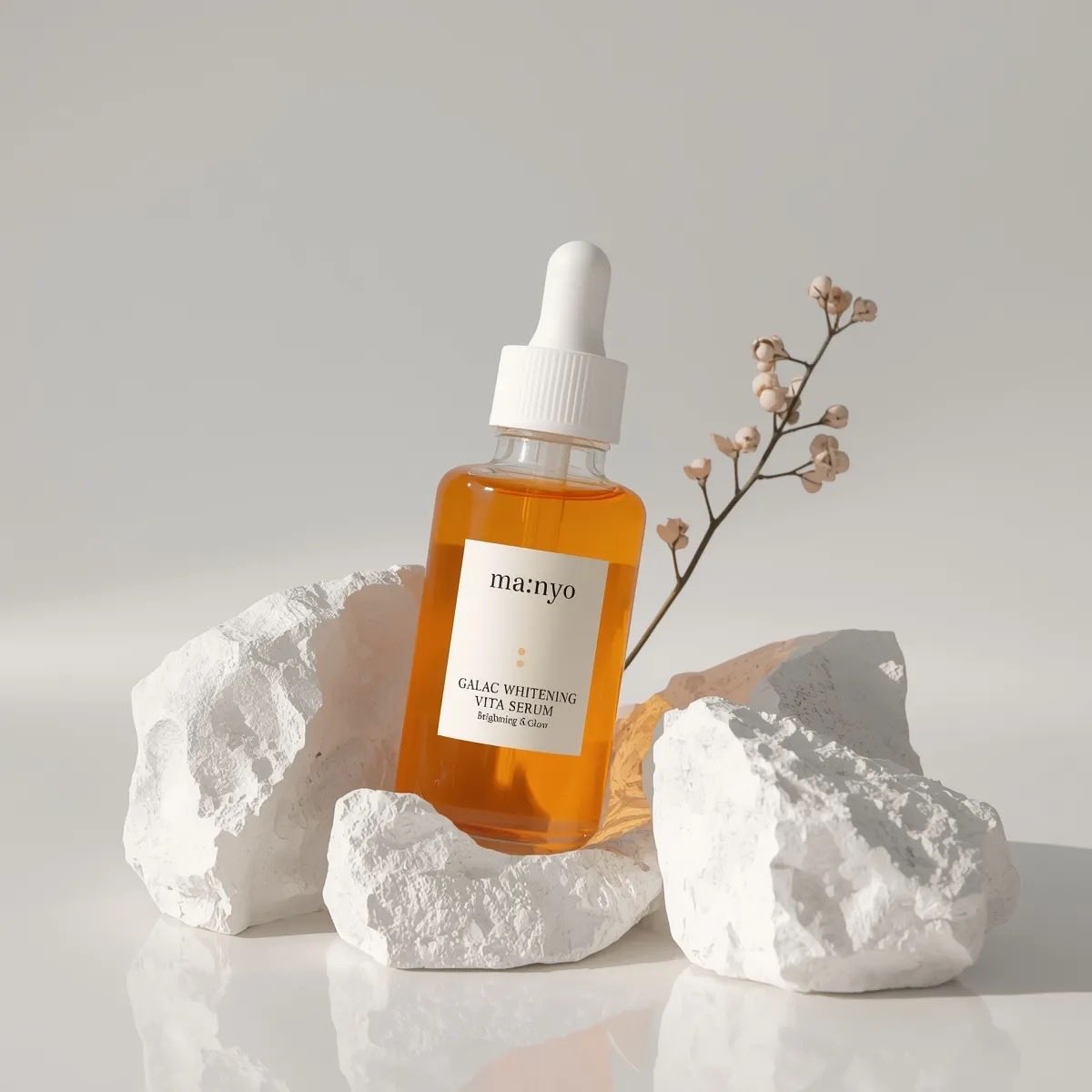 Minimalist studio product photography of an amber glass drop